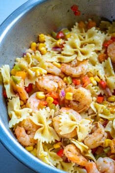 pasta with shrimp and vegetables in a pan