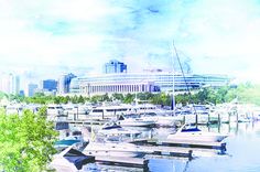 the water is full of boats in front of a large building with a boat dock