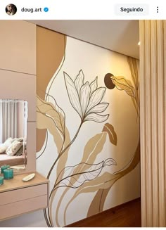 a room with a mirror, dresser and wallpaper on it's walls that has flowers painted on it