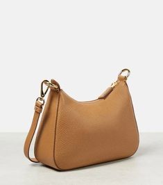 Material: leather.Lining: leather.Made in Italy.Designer color name: Caramel x 1.Internal details: card slot.Closure: zipped top.Detachable, adjustable shoulder strap.Height 17cm-6.5'.Max. width 24,5cm-9.5'.Max. depth 7cm-3'.Min. length shoulder strap 80cm-31.5'.Max. length shoulder strap 119cm-47'.Min. strap length 102cm-40'.Max. strap length 112cm-44' Everyday Camel Shoulder Bag With Gold-tone Hardware, Camel Leather Bag With Zipper Closure, Business Tan Shoulder Bag With Adjustable Strap, Tan Soft Leather Crossbody Shoulder Bag, Prada Logo, Prada Bags, Free Bag, Prada Bag, Women's Bags