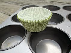 a cupcake tin sitting on top of a muffin pan