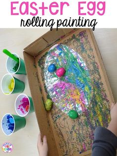 an easter egg painting is shown in the box