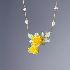 Handmade Yellow Rose Flower and Leaves Necklace Spread joy and love with this handmade necklace featuring a stunning yellow rose and delicate leaves. The yellow rose has long been a symbol of friendship, making this necklace a perfect gift for a special friend. Add a touch of beauty to any outfit with this unique piece. As a gift shop, we offer a complimentary gift box for every order. Detail: - Size of flower: 20mm*40mm; length of necklace: around 53cm Material: flowers - resin; beads - freshwa Yellow Rose Flower, Friendship Symbols, Peridot Crystal, Leaf Necklace, Special Friend, Yellow Roses, Flower Gift, Rose Flower, Crystals And Gemstones