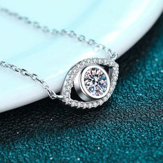 Shine all day with the Angel Eye Round Cut Necklace, adorned with a sparkling 0.5 carat moissanite diamond. This exquisite pendant necklace is made with durable and high-quality S925 material, making it the perfect accessory for any occasion. Bring some celestial magic to your outfit and make heads turn! GRA Certificate & Deluxe Gift Box included. Contact us if you want to customize your design. AZ425-X Moissanite Vs Diamond, Dance Necklace, Angel Eye, Moissanite Necklace, Natural Gemstone Jewelry, Round Necklace, Evil Eye Pendant, Necklace Size, 925 Jewelry