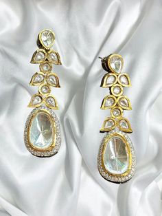 Beautiful uncut polki vintage earrings with gold diamond work and a modern luxurious look for any jewelry lover! The earrings are inspired by the royal princely states of rajasthan and have handwork done with diamond work added for a luxurious look! This lightweight and elegant earring is perfect for any bridesmaid, bride, sangeet or any occasion or event as a gift for any occasion as any one who loves jewelry will love this statement piece. It has beautiful colors that really make the set a statement piece. There are 4 colors available in these earrings and each of them are made with the highest quality stones. Product Details: * Earrings  Ready to Ship and available immediately if you place an order today! Fast Shipping US Customers receive your order within 5-7 business days. This is th Luxury Hand Set Bollywood Earrings, Luxury Gold Plated Bridal Earrings With Meenakari, Luxury Gold Jhumkas With Stone Work, Glamorous Wedding Earrings For Festive Occasions, Glamorous Wedding Earrings For Festive Season, Glamorous Festive Wedding Earrings, Elegant Kundan Drop Earrings, Elegant Kundan Drop Danglers, Traditional Festive Crystal Drop Earrings