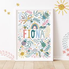 a white framed print with the word flora surrounded by flowers, birds and rainbows