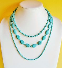 This is a very eye catching piece that you can use to dress up or down. The turquoise color is very popular and eye catching as well. I crafted the whole necklace with genuine Turquoise and Magnesite gemstone beads in different shapes and sizes. It is made of three strands, where the shortest strand is about 16 inches long while the longest strand is about 23 inches long. A lobster  heart clasp finishes off the necklace with a 3 inch long extender. TIP: I enjoy wearing my necklace with silver ch Turquoise Multi-strand Gemstone Necklaces, Turquoise Multi-strand Gemstone Necklace, Turquoise Gemstone Multi-strand Necklace, Elegant Multi-strand Turquoise Necklace Gift, Double Strand Turquoise Gemstone Beads Necklace Gift, Double Strand Turquoise Necklace With Gemstone Beads As Gift, Double Strand Turquoise Necklace For Gift, Multi-strand Turquoise Necklace For Gifts, Turquoise Multi-strand Necklace For Gift