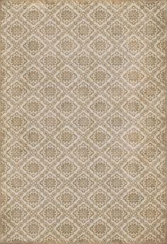 a beige rug with an intricate design on it