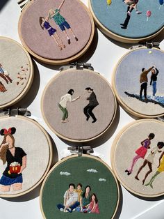 embroidered pictures of people on different types of embroiderys are displayed in small hoop frames