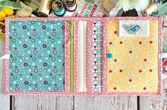 the inside of a scrapbook is covered in papers and sewing threads, along with other crafting supplies