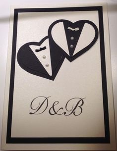 wedding card with two tuxedos and the word d & b written on it