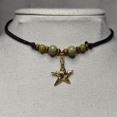 Green Ceramic Beaded Gold Swirl Starfish Charm Boho Hippie Beach Adjustable Black Rope Cord Choker Stacking Necklace Comes On An Adjustable Waxed Black Cord Necklace. Necklace Is Adjustable From Approximately 13" To 22". To Wear Your Necklace Pull The Two Knots Away From The Pendant To Adjust To A Larger Size, Leave About An Inch Of Space Between The Two Knots To Prevent It From Getting Stuck. Put Cord Around Your Neck And Pull The Two Knots In The Opposite Direction To Adjust To A Smaller Size. Casual Adjustable Star Necklaces, Adjustable Star Charm Festival Jewelry, Adjustable Star Charm Jewelry For Festivals, Beach Jewelry With Adjustable Star Charm, Adjustable Star Charm Jewelry For Beach, Beach Adjustable Jewelry With Star Charm, Adjustable Beach Jewelry With Star Charm, Star-shaped Colorful Beaded Jewelry For The Beach, Star-shaped Colorful Beads Jewelry For Beach