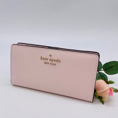 Brand New With Tag Kate Spade Staci Large Slim Bifold Wallet Color: Light Rose Details Saffiano Leather Two Way Spade Jacquard Lining Snap Closure 12 Credit Card Slots Id Window 4 Slip Pockets Zip Compartment On Back Of Wallet Approx. Measurements: 3.5"H X 6.7"W Pink Rectangular Feminine Wallet, Pink Feminine Rectangular Wallet, Feminine Pink Wallets For Daily Use, Pink Feminine Wallet For Everyday Use, Feminine Pink Wallet For Everyday Use, Evening Pink Bags With Card Slots, Pink Evening Bags With Card Slots, Pink Feminine Wallet For Everyday, Feminine Pink Wallet