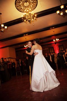 a bride and groom sharing their first dance