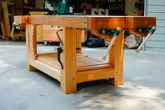 a wooden table with two skates attached to it