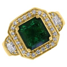 Rustic yet chic, the Emma emerald ring features a stunning deep green emerald highlighted by the glow of yellow gold and lustrous diamonds. It is a unique piece, ideal for someone who enjoys defining their own style. Gemstones Type: Emerald Gemstones Shape: Rectangular Gemstones Weight: 2.26 ct Gemstones Color: Green Diamonds Shape: Round & Half Moon Side Diamonds Weight: 0.56 ct Side Diamond Color: F - G Side Diamond Clarity: VS (Very Slightly Included) Metal: 18 K Yellow Gold Metal Wt: 7.57 gm Green Diamonds, Emerald And Diamond Ring, Emerald Diamond Ring, Vintage Style Rings, Diamond Brooch, Modern Ring, Wedding Ring Designs, Green Diamond, The Glow