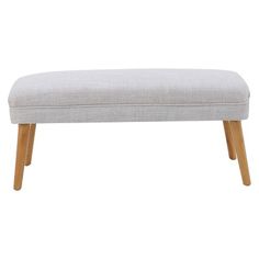 an upholstered bench with wooden legs and a light gray fabric seat cover on it