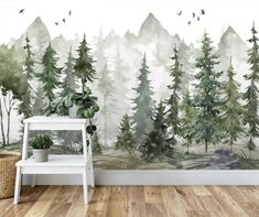 a wall mural with trees and birds in the woods, on a wooden floor next to a white bench