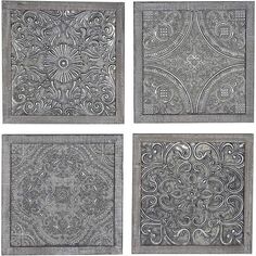 four square metal plaques with intricate designs on them