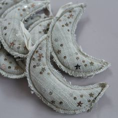 several pieces of white fabric with gold stars on them