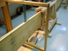 a racket is sitting in the middle of a workbench made out of wood