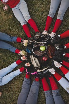 a group of baseball players standing in a circle with their hands on each other's hips