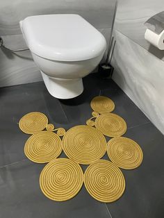 a bathroom with yellow circles on the floor