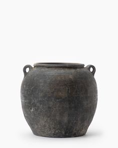 an old black pot is shown on a white background