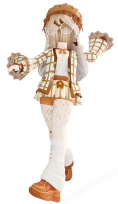 a doll dressed in white and brown is standing with her arms spread out to the side