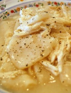 a close up of a plate of food with meat and gravy on it