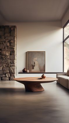 a living room filled with furniture and a stone wall