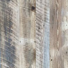 an image of wood planks that have been painted white and brown with blue streaks