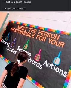 a girl standing in front of a sign that says, meet the person responsible for your choice