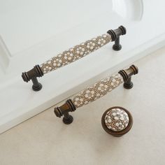 a white bath tub sitting next to a sink under a faucet mounted on a wall