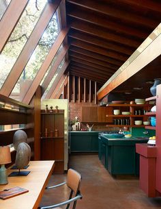 the kitchen is very large and has wooden ceilings