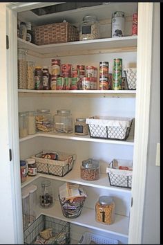 an open pantry with lots of food in it