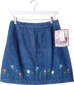 90's Deadstock Route 66 a-line mini denim skirt with embroidered flowers. Zip up back.Measurements approx layflat Waist 14. 5"Hip 21"Length 18. 5"Size Vintage Juniors 9/10Fits like a M Jean Skirt Mini, 70s Skirt, Mini Denim Skirt, 90s Aesthetic, Pretty Clothes, Skirt Mini, Route 66, Jean Skirt, Embroidered Flowers