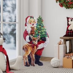 a christmas scene with santa claus holding a deer next to a tree and other holiday decorations