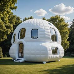 an inflatable house is sitting on the grass