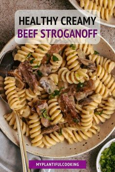 a bowl filled with pasta and meat on top of a table