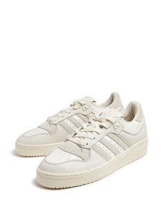 Find ADIDAS Rivalry 86 Lace-up Sneakers on Editorialist. white/beige leather panelled design signature 3-Stripes logo round toe logo patch at the tongue branded heel counter front lace-up fastening branded leather insole flat rubber sole Classic Off White Sneakers For Streetwear, Classic Off-white Sneakers For Streetwear, Off White Boost Midsole Sneakers For Streetwear, Off White Sneakers With Boost Midsole For Streetwear, Off-white Boost Midsole Sneakers For Streetwear, Off White Boost Sneakers For Streetwear, Cream Adidas Sneakers For Streetwear, Sporty Cream Adidas Sneakers, Classic Cream High-top Sneakers