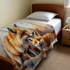 a bed with two foxes on it next to a night stand