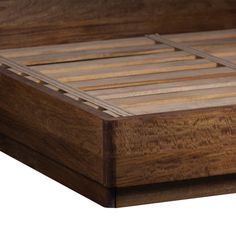 a wooden bed frame with slats on the top and bottom part in dark wood