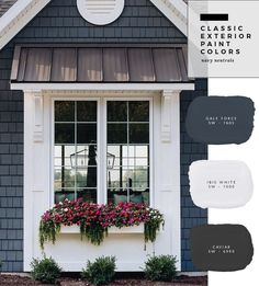 the exterior of a gray house with white trim and window boxes filled with pink flowers