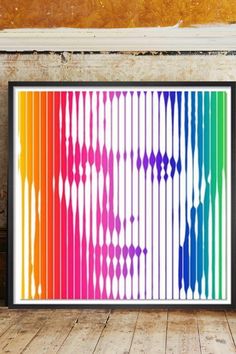 a colorful art print hanging on the wall