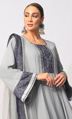 Indulge in the timeless allure of this enchanting 3-piece Anarkali suit, meticulously crafted to captivate hearts and turn heads. The centerpiece of this ensemble is the Anarkali kurta, boasting a graceful silhouette that cascades elegantly, accentuated by a mesmerizing border of foil print fabric and delicate lace trim. Complementing this regal kurta are the straight pants, offering a perfect balance of comfort and style with their form-fitting design. Completing the look is a matching dupatta adorned with the same exquisite foil print fabric and lace border, adding an extra layer of refinement. Whether it's a festive occasion, cultural event, or special gathering, this ensemble promises to elevate your style quotient with its unparalleled charm and sophistication, leaving a lasting impre Foil Print Fabric, Grey Anarkali, Kids Abaya, Anarkali Kurta, Mens Items, Anarkali Suit, Cultural Events, Kids Items, Lace Border