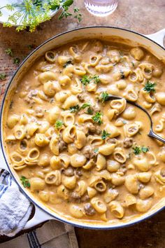 a large pot filled with pasta and meat