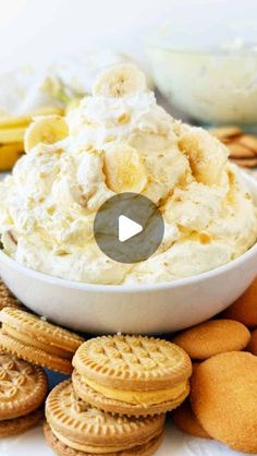 a bowl filled with ice cream surrounded by cookies and crackers