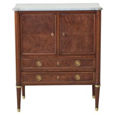 an old wooden cabinet with marble top and brass pulls on the bottom, against a white background