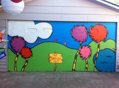 a garage door painted with the dr seuss theme